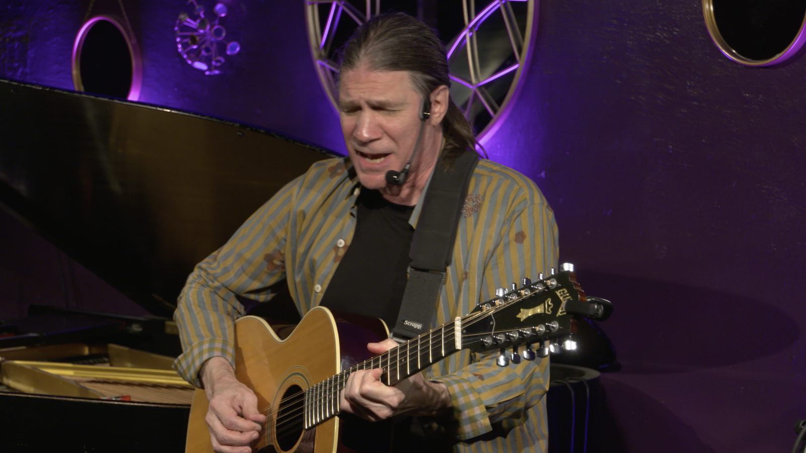 Ernie Savage singing with the twelve-string guitar